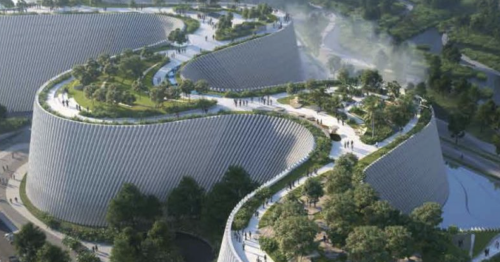 Vista panorâmica do novo Museu de História Natural de Shenzhen com design curvo e integrado à paisagem.